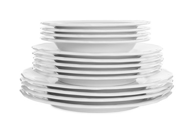 Stack of clean plates on white background