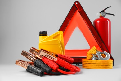 Set of car safety equipment on light grey background