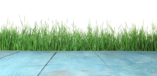 Photo of Blue wooden deck and green grass isolated on white