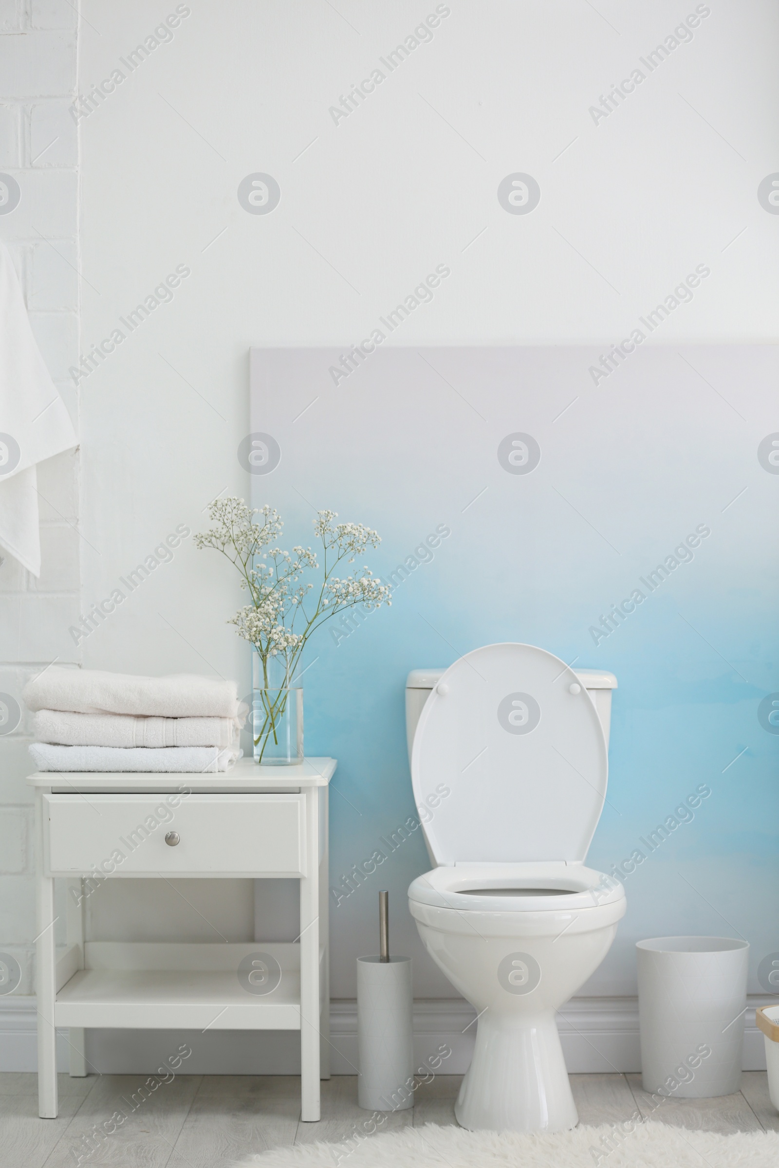 Photo of Modern toilet bowl in stylish bathroom interior