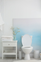 Modern toilet bowl in stylish bathroom interior