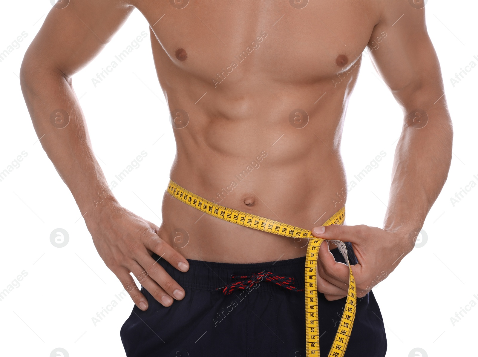 Photo of Shirtless man with slim body and measuring tape around his waist isolated on white, closeup