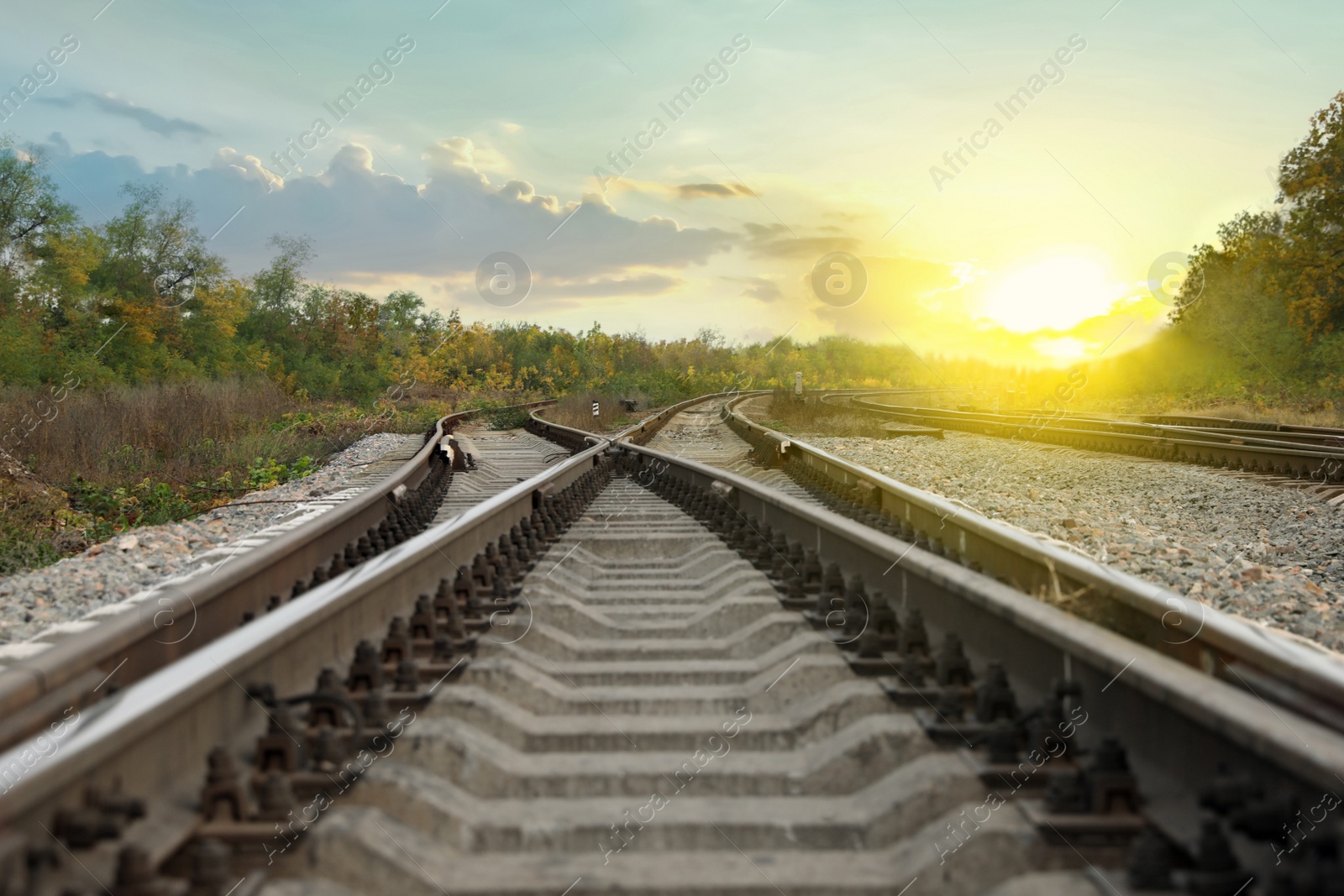 Photo of Railway lines with track ballast in countryside. Train journey