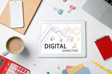 Image of Digital marketing concept. Modern tablet on workplace, flat lay
