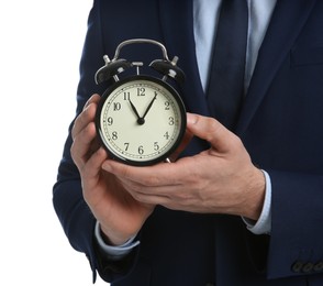 Photo of Businessman holding alarm clock on white background, closeup. Time management
