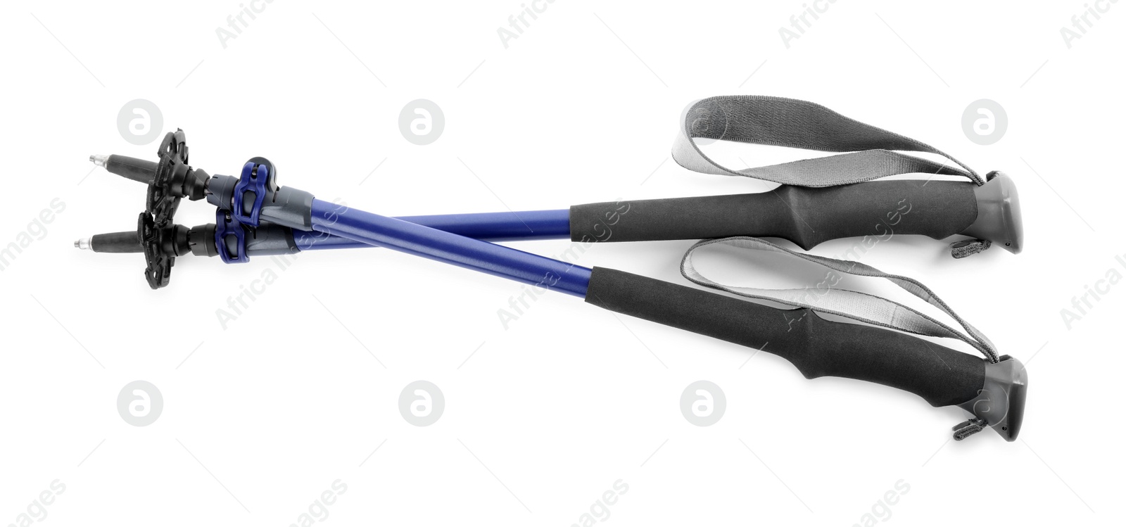 Photo of Pair of trekking poles on white background, top view. Camping tourism