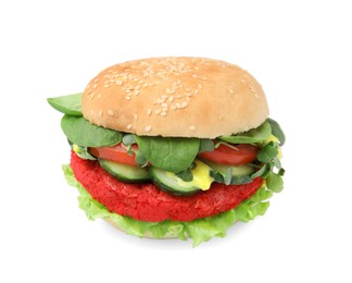 Photo of Tasty vegan burger with vegetables, patty and microgreens on white tiled table, closeup. Space for text