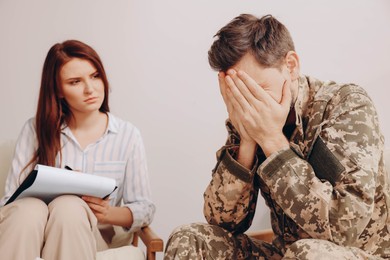 Psychologist working with military officer in office