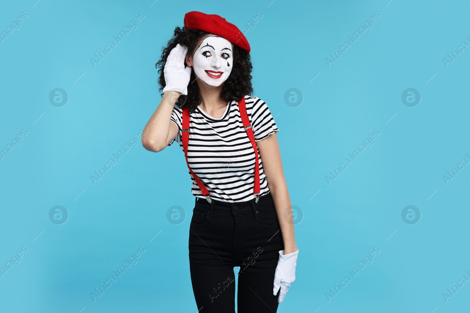 Photo of Funny mine with beret posing on light blue background