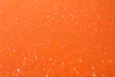 Orange textured surface as background, closeup view