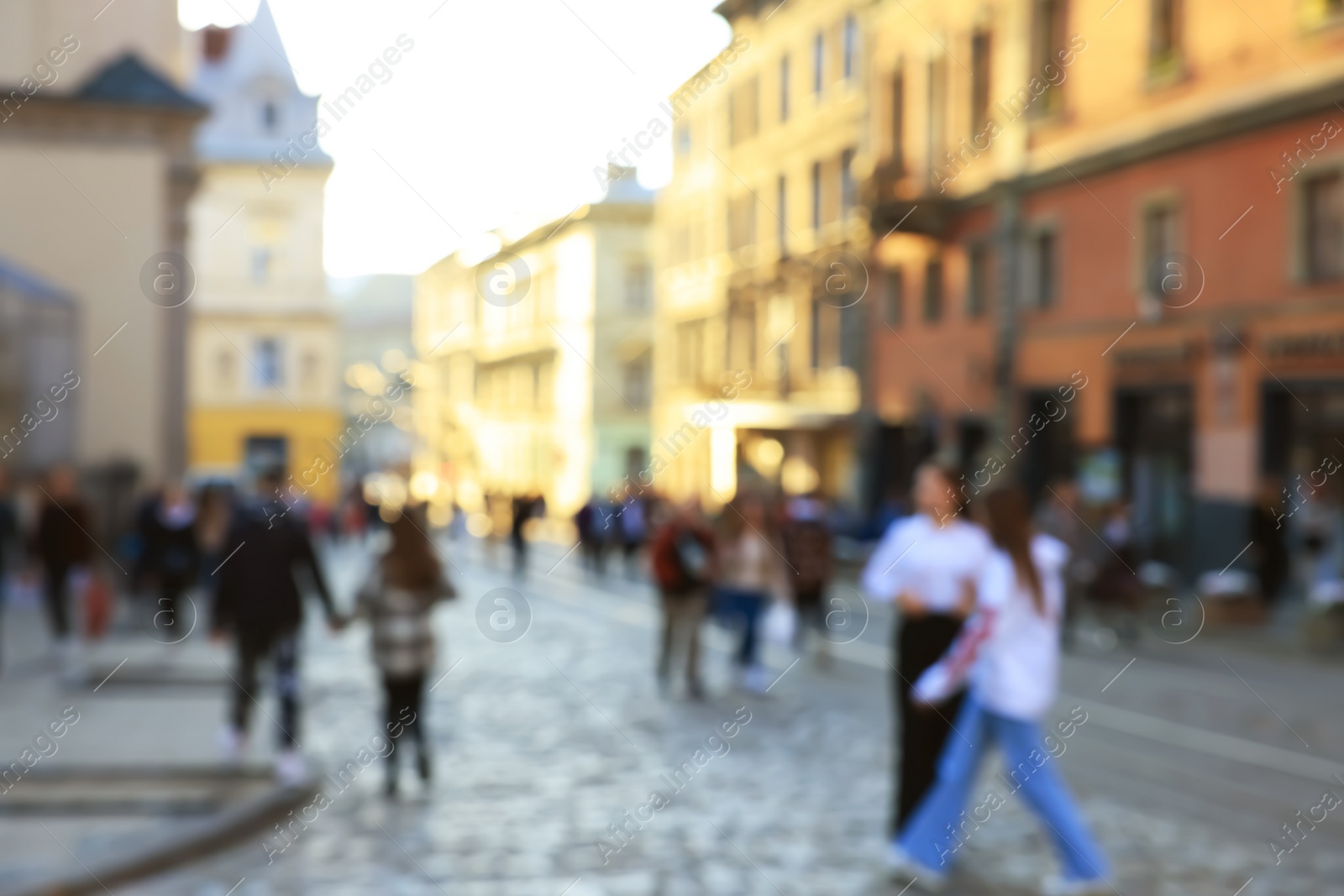 Photo of Blurred view of people walking on city street