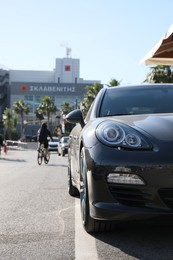 PIRAEUS, GREECE - MAY 19, 2022: Black Porsche Panamera car on city road
