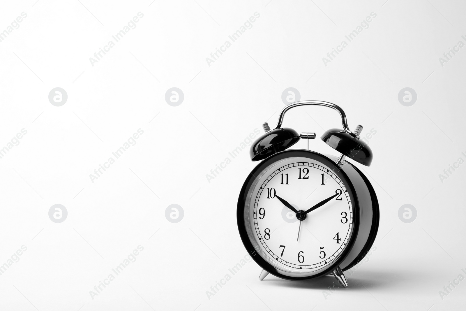 Photo of Alarm clock on white background. Time concept