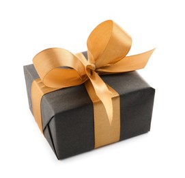 Photo of Black gift box with golden bow on white background