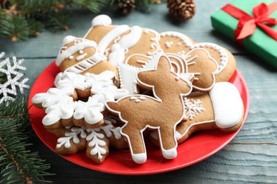 Photo of Delicious Christmas cookies on blue wooden table, closeup