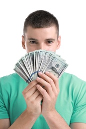 Handsome young man with dollars on white background