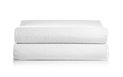 Photo of Clean soft orthopedic pillows on white background