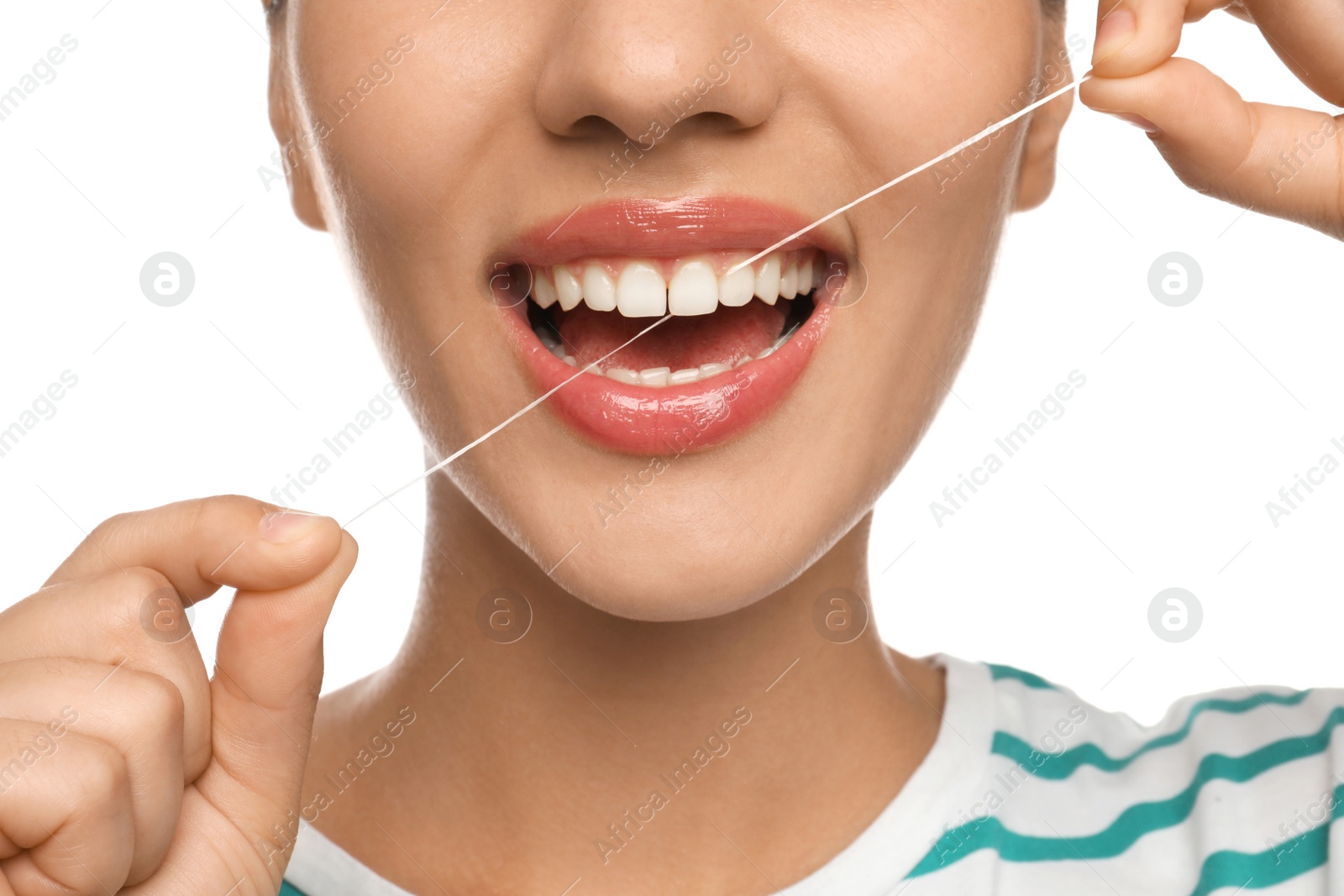 Photo of Young woman flossing her teeth on white background, closeup. Cosmetic dentistry