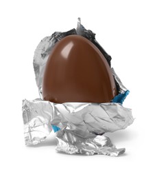 Photo of Tasty chocolate egg in foil isolated on white