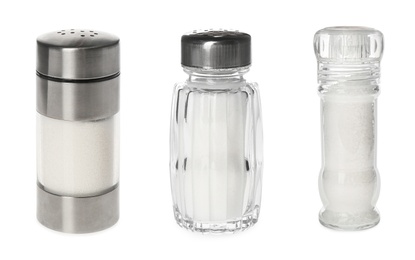 Set of shakers with salt on white background