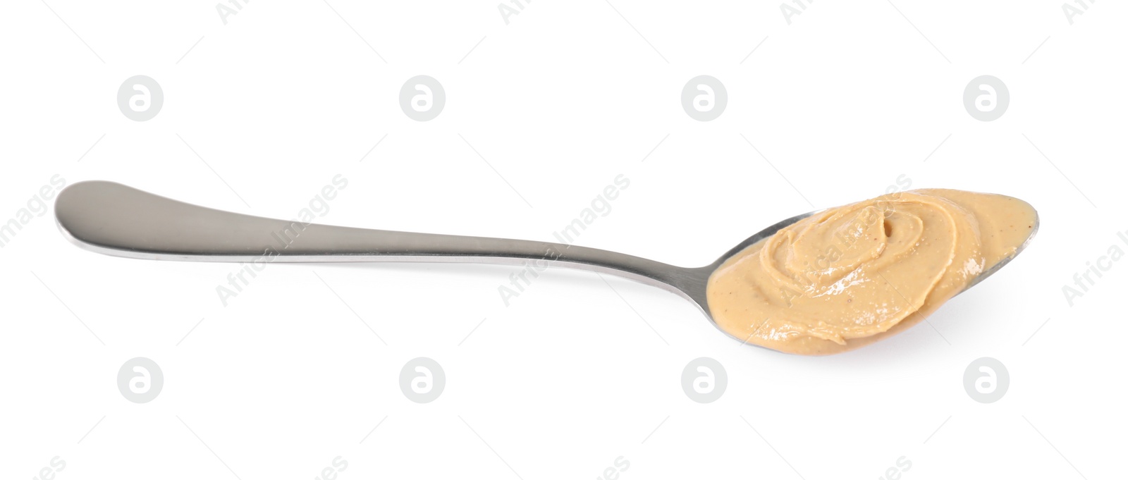 Photo of Delicious nut butter in spoon isolated on white