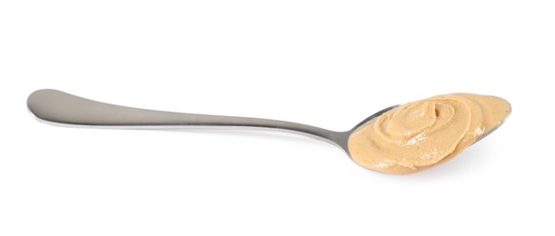 Photo of Delicious nut butter in spoon isolated on white