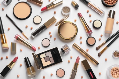 Photo of Different luxury makeup products on white background, top view