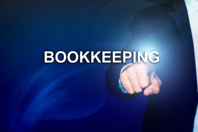 Image of Bookkeeping concept. Businessman pointing at word on dark blue background, closeup