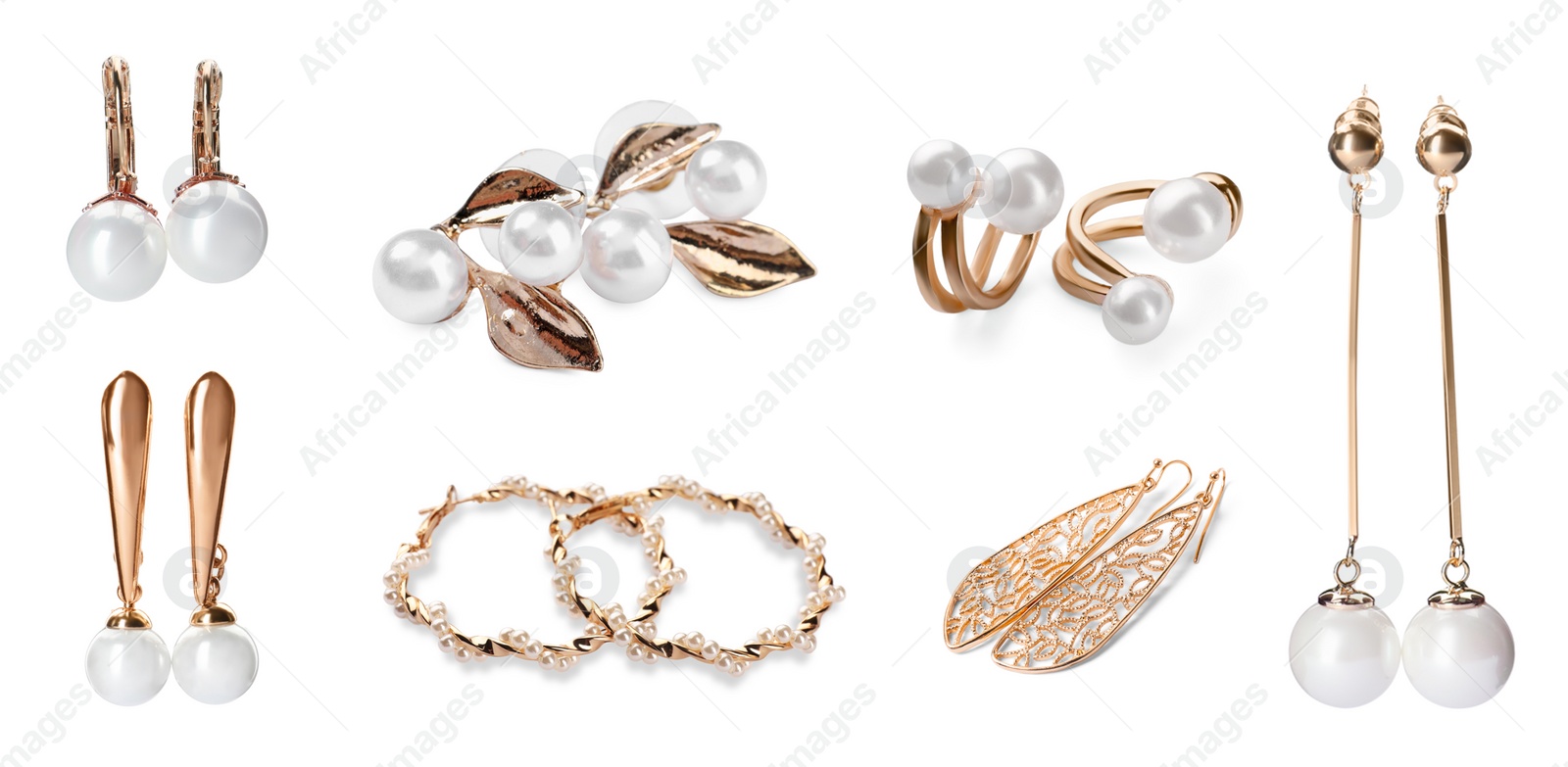 Image of Set of many different golden earrings isolated on white