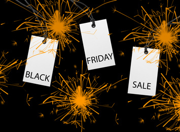 Different tags on color background, flat lay. Black Friday 