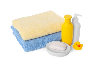 Baby cosmetic products, bath duck and towels isolated on white