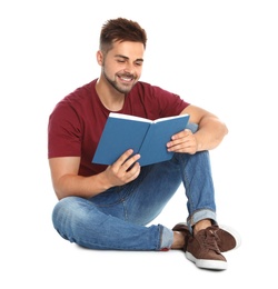 Photo of Handsome young man reading book on white background