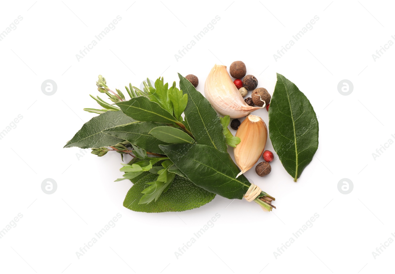 Photo of Bundle of aromatic bay leaves, different herbs and spices isolated on white, top view