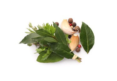 Bundle of aromatic bay leaves, different herbs and spices isolated on white, top view