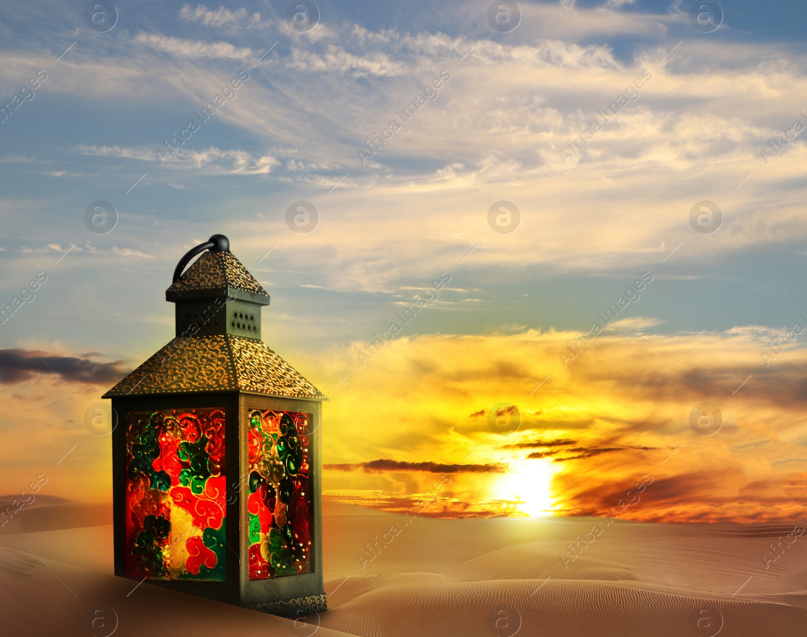 Image of Beautiful Arabic lantern on sand at sunrise, space for text