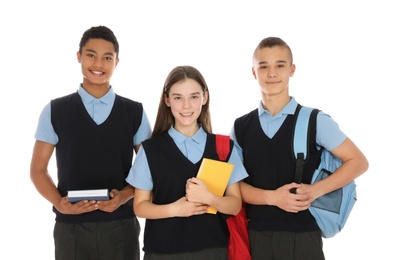 Portrait of teenagers in school uniform on white background