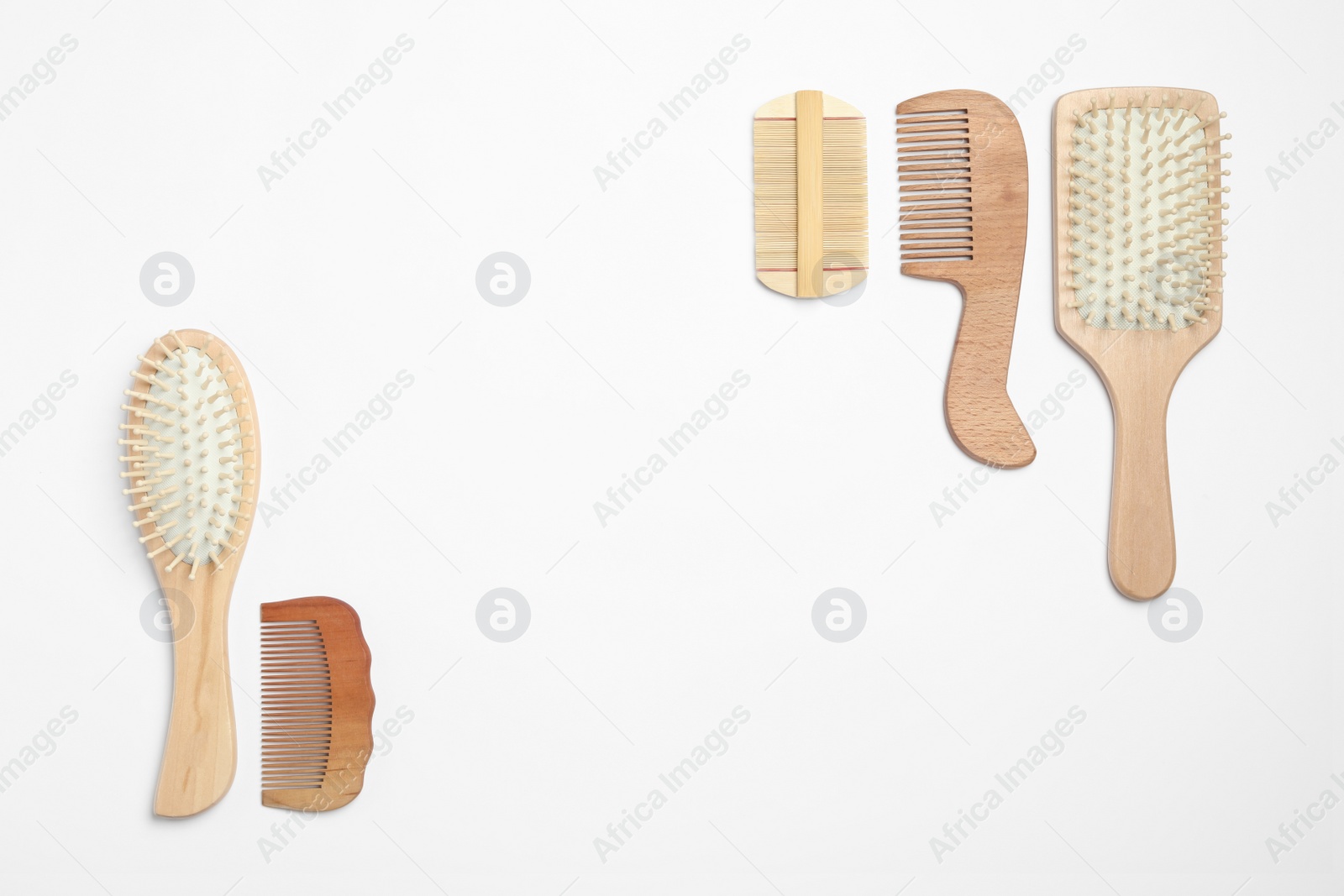 Photo of Composition with hair combs and brushes on white background, top view