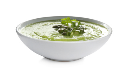 Delicious asparagus soup with arugula isolated on white