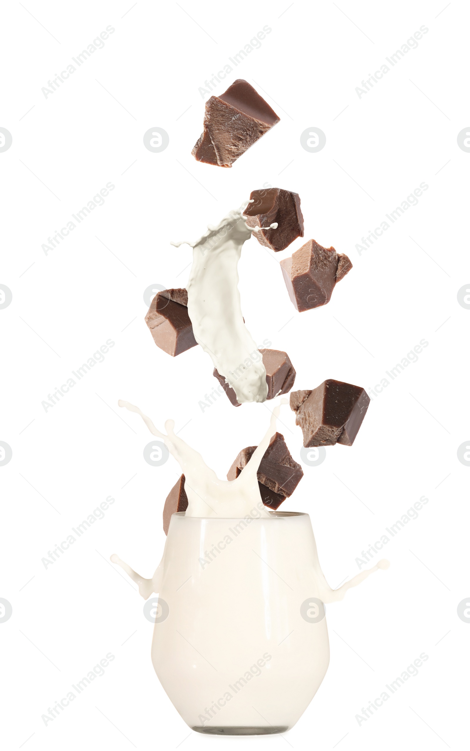 Chocolate falling into glass with milk on white background Image of Chocolate falling into glass with milk on white background