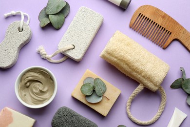 Photo of Flat lay composition with pumice stones on violet background