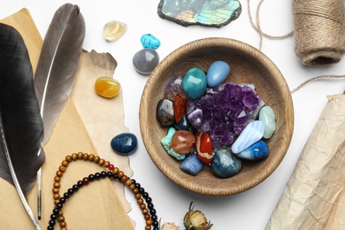 Flat lay composition with different gemstones on white background