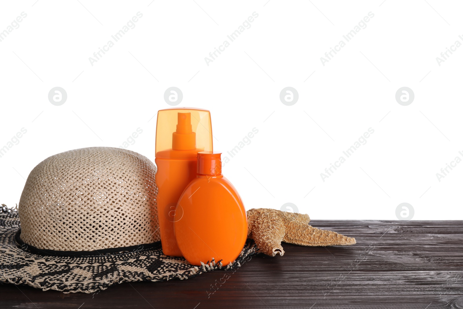 Photo of Composition with sun protection products on wooden table against white background. Space for text