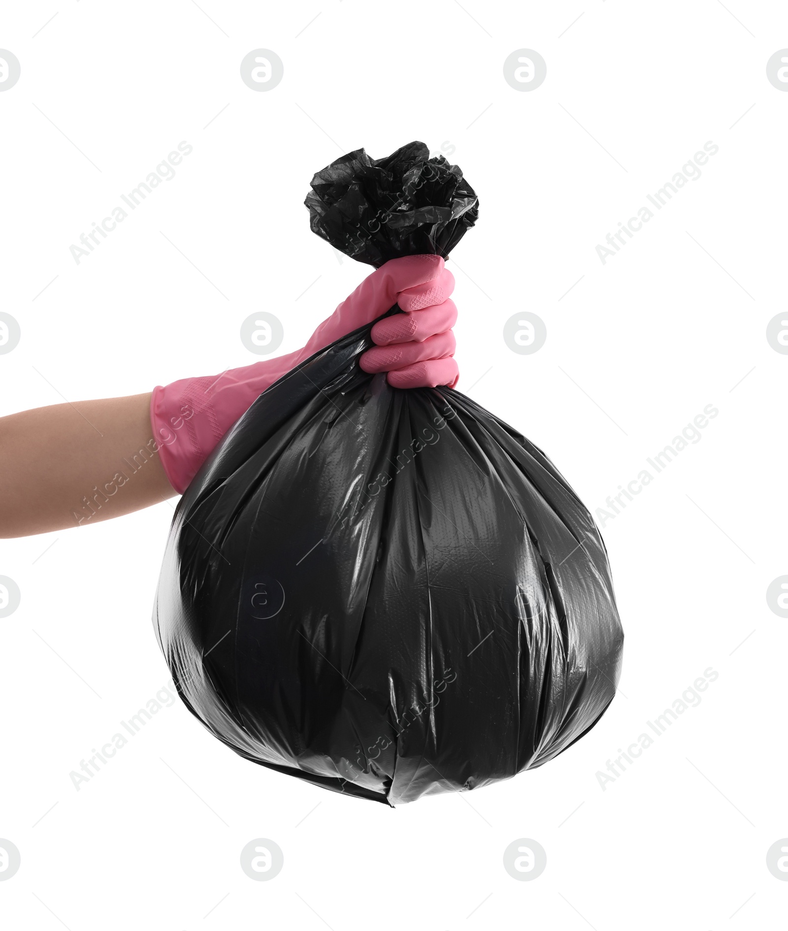 Photo of Woman holding plastic bag full of garbage on white background, closeup