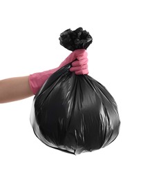 Photo of Woman holding plastic bag full of garbage on white background, closeup