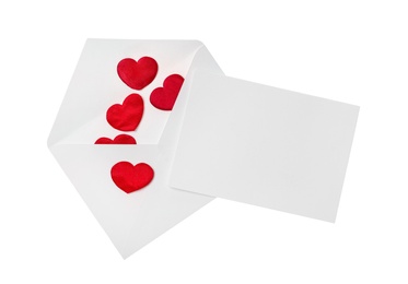 Blank card, envelope and red decorative hearts on white background, top view. Valentine's Day celebration