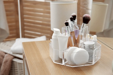 Organizer with cosmetic products and space for text on dressing table