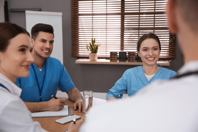 Team of professional doctors having meeting in office