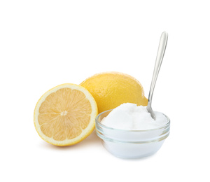 Photo of Baking soda and cut lemons on white background