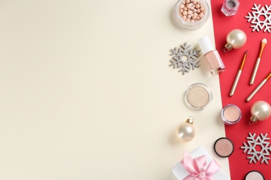 Photo of Flat lay composition with decorative cosmetic products on color background, space for text. Winter care
