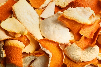 Photo of Many dry orange peels as background, closeup